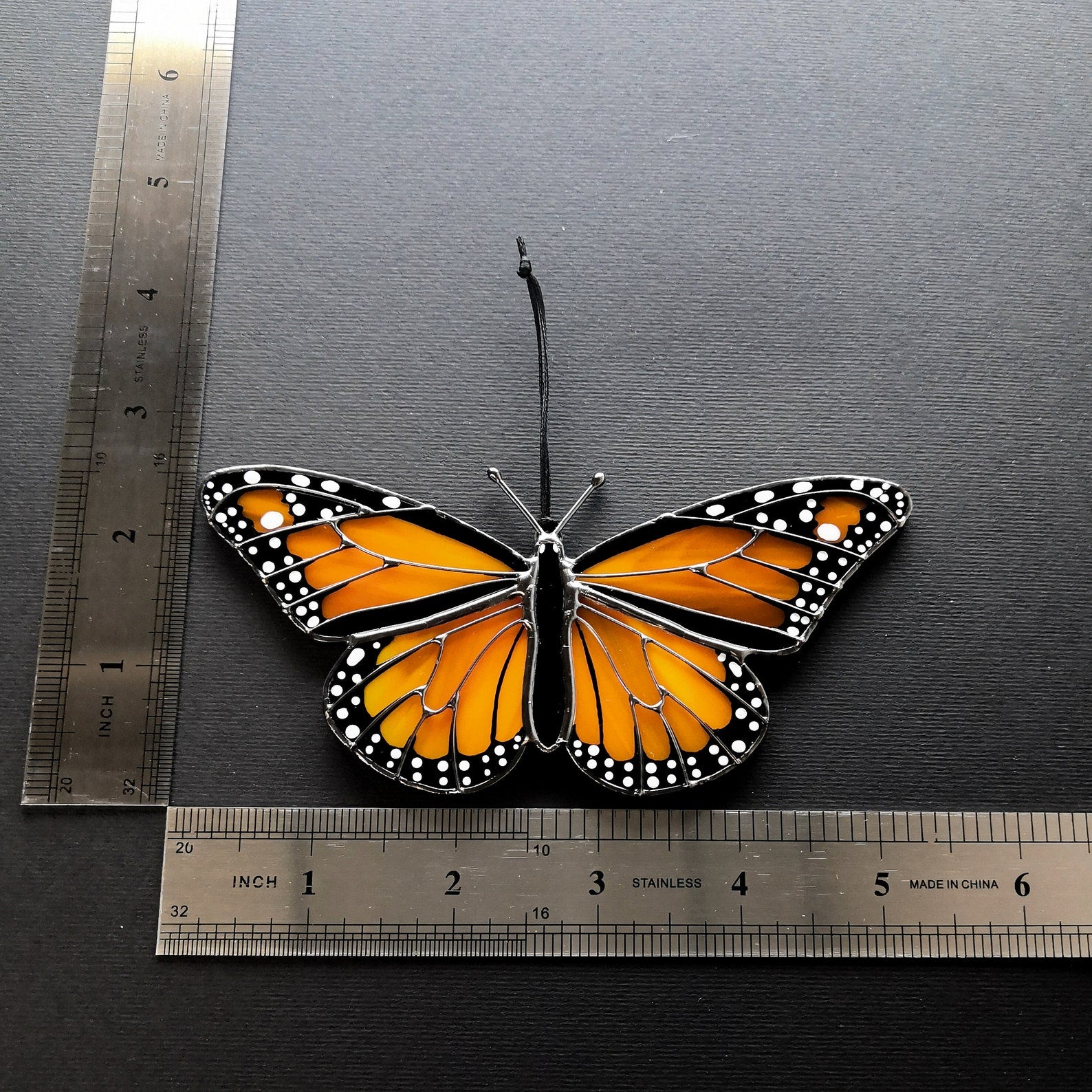 Detailed view of monarch butterfly stained glass window decoration